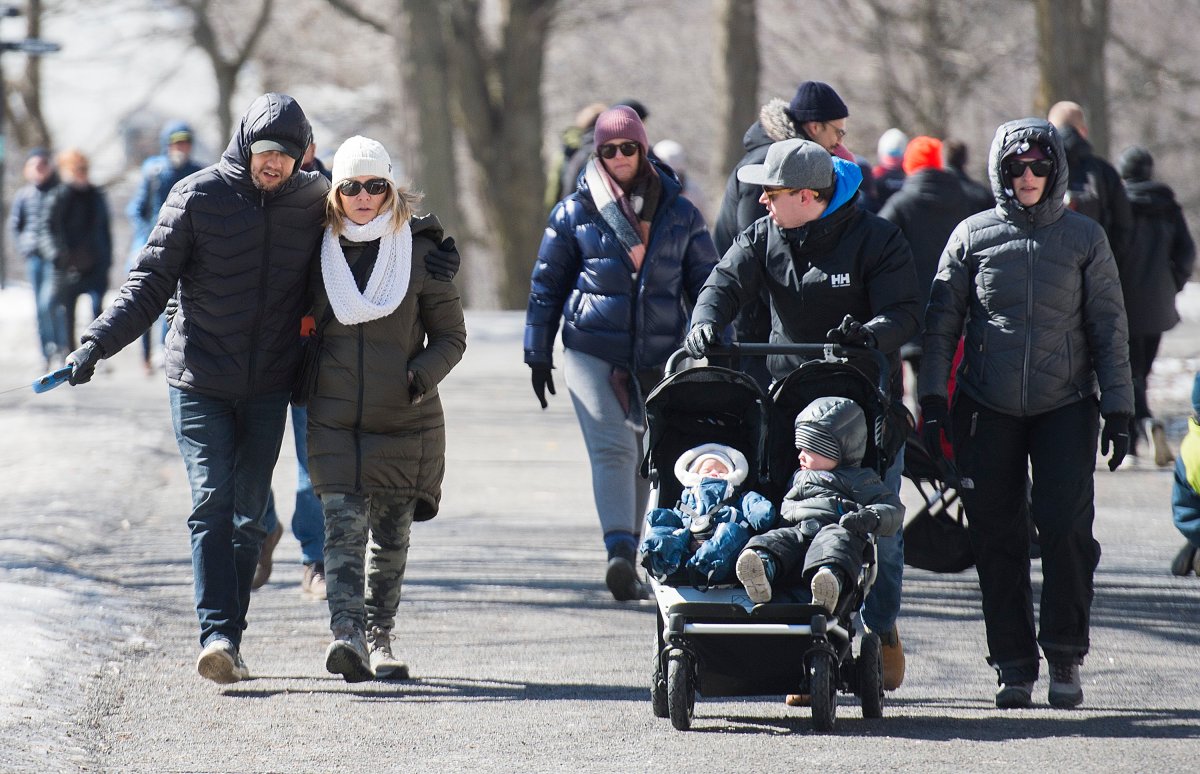 People take a walk in Mount Royal park in Montreal, Saturday, March 21, 2020, as COVID-19 cases rise in Canada and around the world.