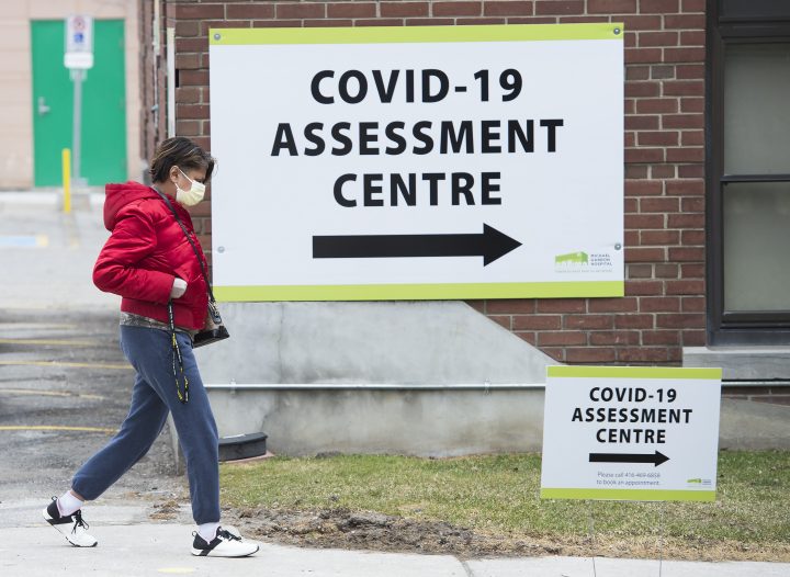 A woman arrives at the COVID-19 assessment centre at the Michael Garron Hospital in Toronto on Tuesday, March 24, 2020.