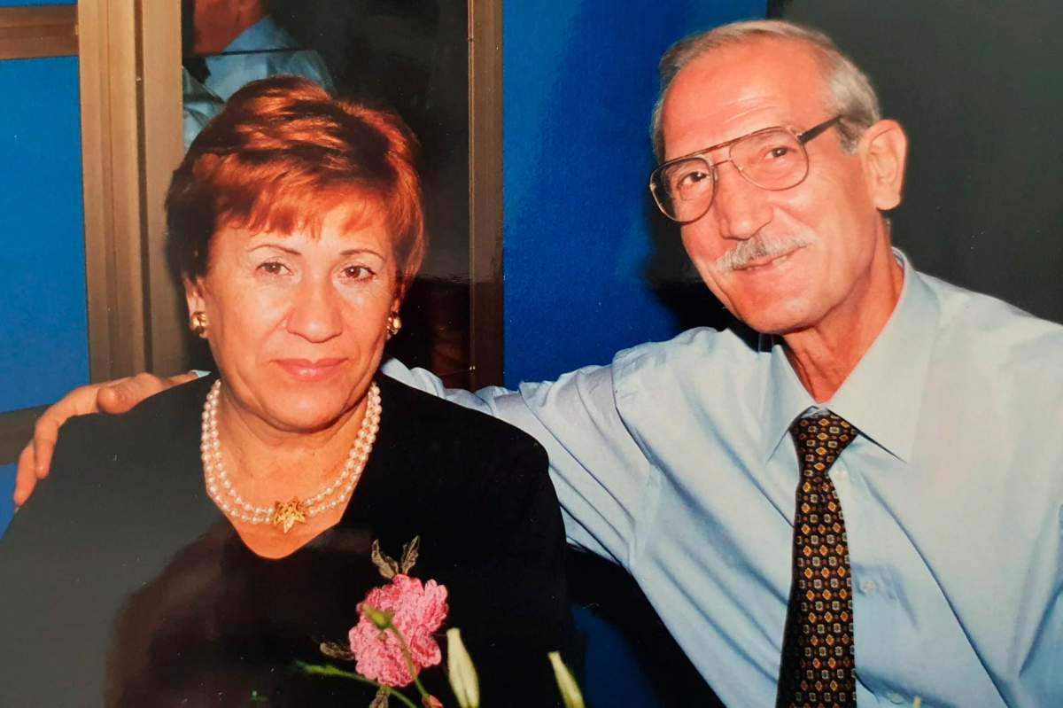 This undated photo provided by the family in April 2020 shows Enrico Giacomoni and his wife, Giulia Chiodi. The last time Roberto Giacomoni saw his 80-year-old father Enrico, he gently helped him up from bed, put his socks, shoes and jacket on, and walked him out to the paramedics who had come to take him to the hospital because he was having trouble breathing. (Courtesy of Giacomoni family via AP).