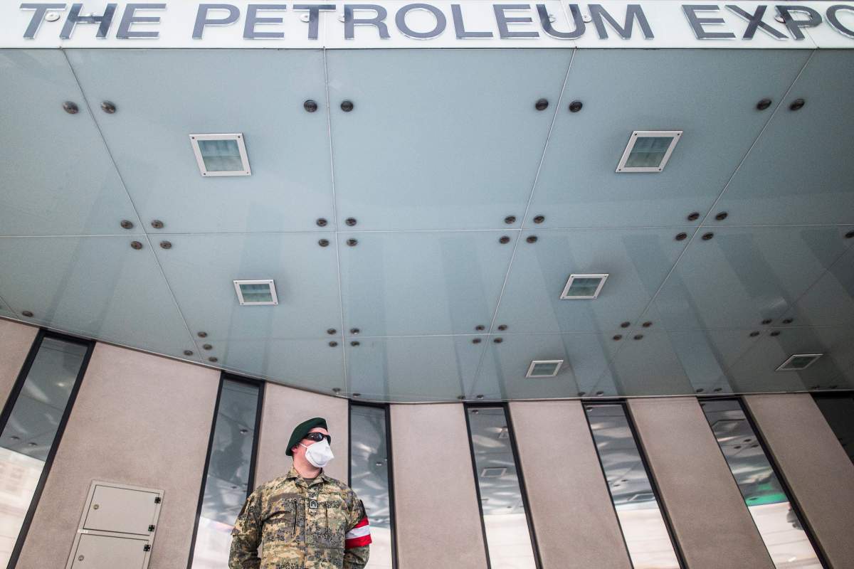 An Austrian Armed Forces soldier wearing a face mask patrols in front of the Organization of Petroleum Exporting Countries (OPEC) headquarters in Vienna, Austria, 09 April 2020.  
