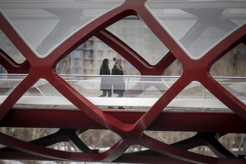 People practice physical distancing in Calgary, Alta., Thursday, April 9, 2020, amid a worldwide COVID-19 pandemic. 