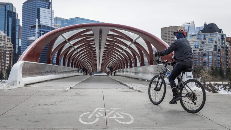 People practice physical distancing in Calgary, Alta., Thursday, April 9, 2020, amid a worldwide COVID-19 pandemic. 