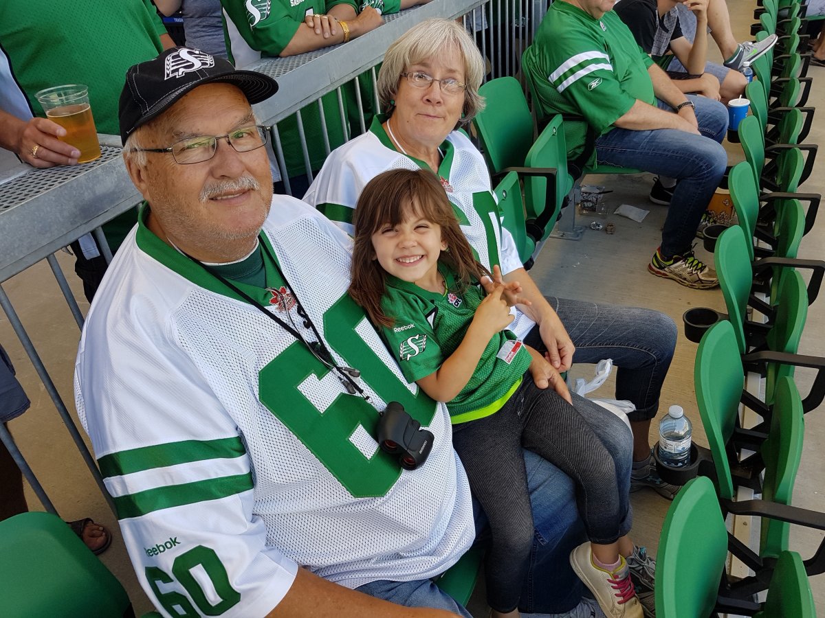 Noble (Butch) Gullacher, his granddaughter Athena and his wife, Kathleen Gullacher, are shown in this handout image at a Rider game in 2019. Noble Gullacher was a family man who loved watching his sons play basketball and his grandchildren play soccer. Gullacher, known by family and friends as Butch, was a diabetic who was waiting for a kidney transplant when he was diagnosed with COVID-19 on March 19. The 69-year-old died April 10 in a Regina hospital. THE CANADIAN PRESS/HO-Kathleen Gullacher .