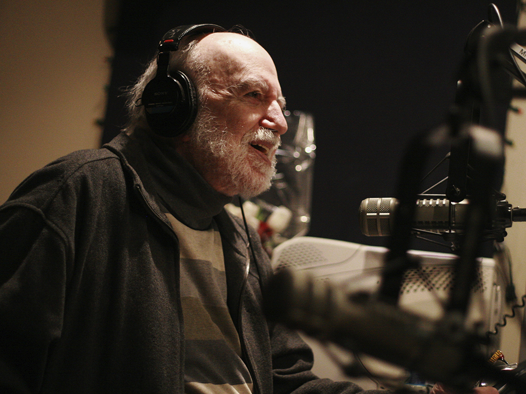 Gene Shay speaks during his radio show on WXPN-FM in Philadelphia. Shay, a folk DJ who spent a half-century on the Philadelphia airwaves and helped promote the careers of Bob Dylan, Joni Mitchell and countless others, has died of complications of the coronavirus.