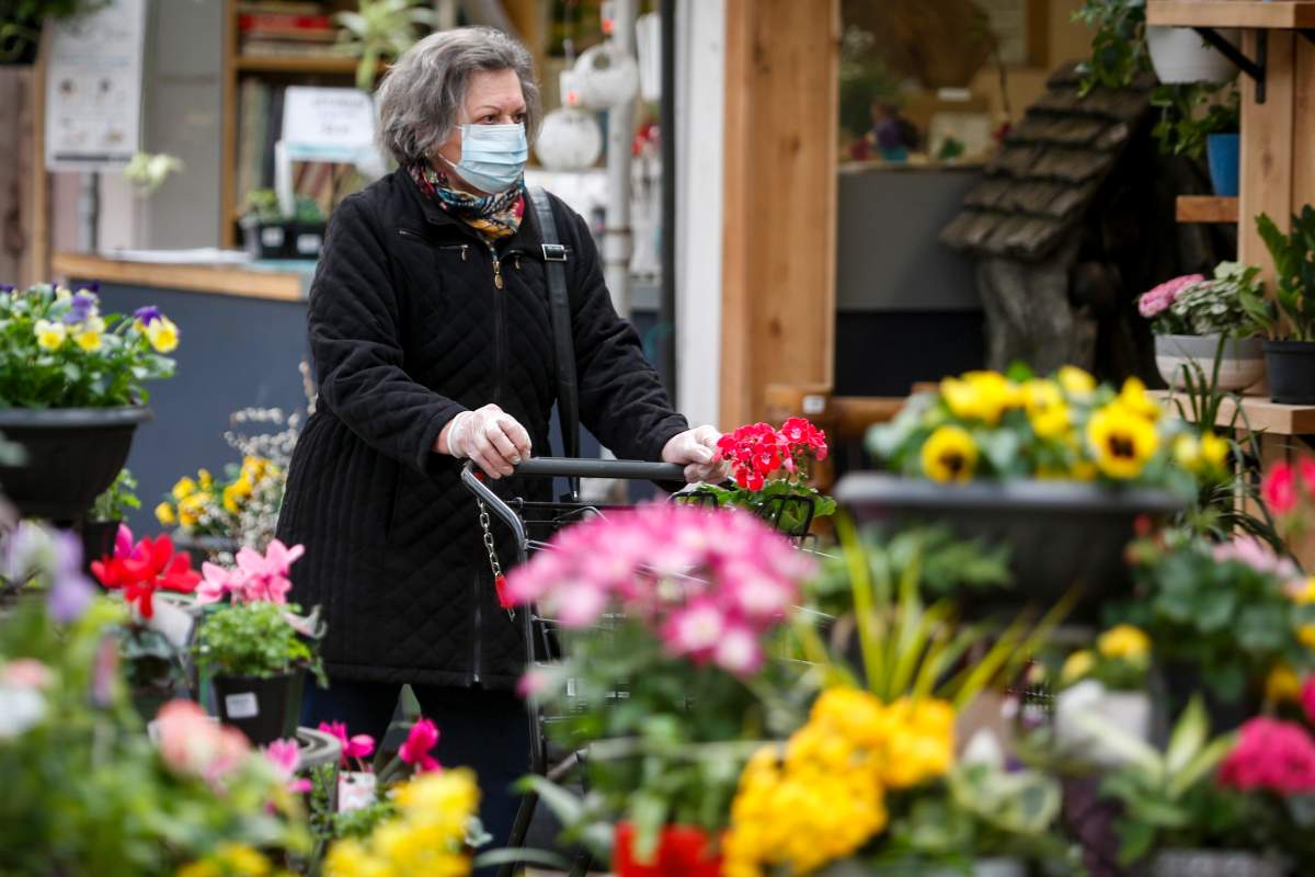 A customer shops at Golden Acre Home and Garden in Calgary, Alta., on Tuesday, April 14, 2020, amid the COVID-19 pandemic.