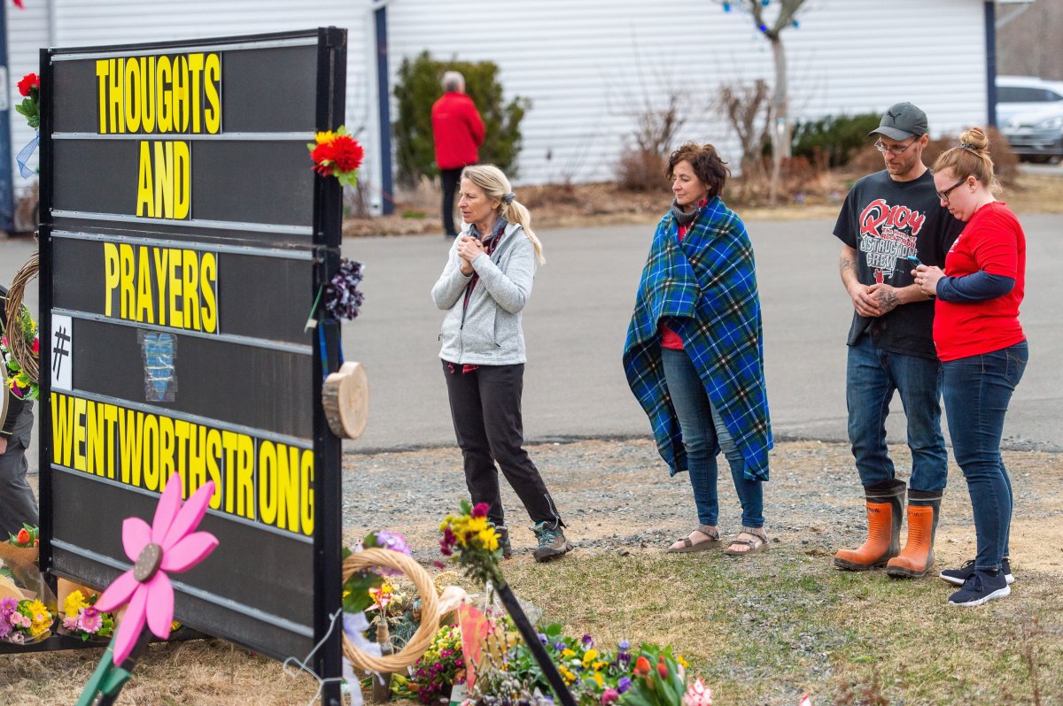Local residents pay their respects at a vigil at the Wentworth Recreation Centre in Wentworth, N.S. on Friday, April 24, 2020.