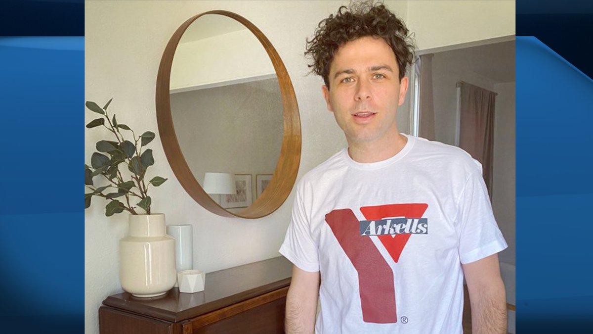 The Arkells' Max Kerman shows off a limited-edition T-shirt designed exclusively for the YMCA Hamilton.