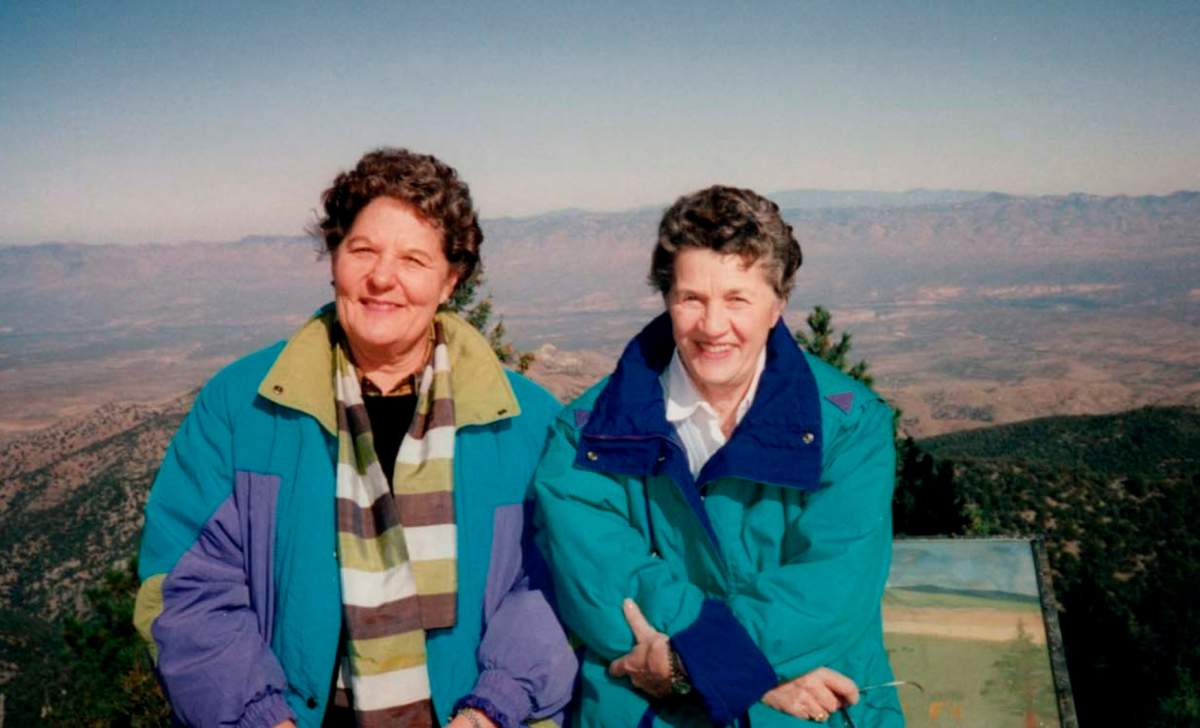 This image released by Netflix shows Pat Henschel, left, and Terry Donahue in a scene from “A Secret Love.”