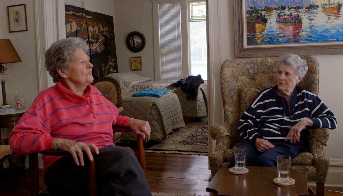 This image released by Netflix shows Pat Henschel, left, and Terry Donahue in a scene from “A Secret Love.”