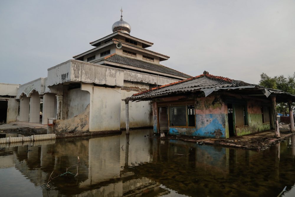 In this file photo, an abandoned house is shown in Pantai Bahagia village in Bekasi, West Java, Indonesia, on Dec. 3, 2019.