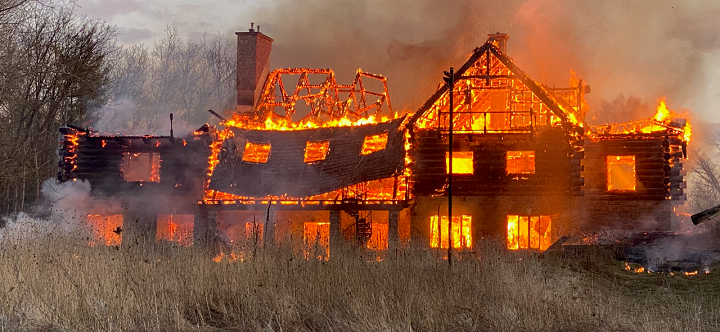 An abandoned log home in Brampton on fire.