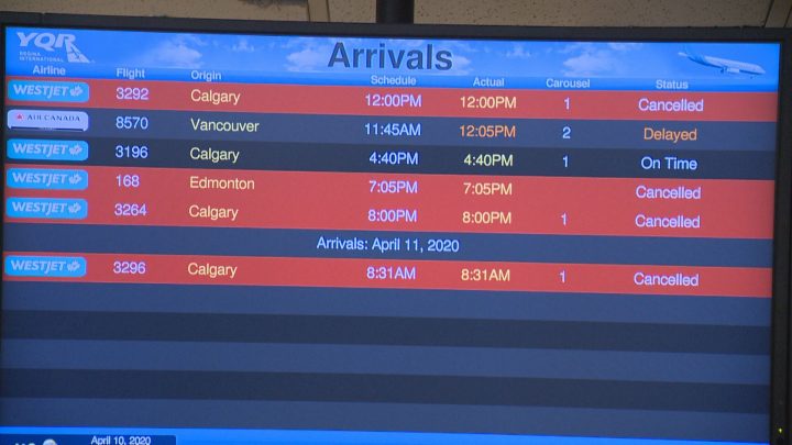 The "arrivals" display at Regina International Airport shows multiple cancelled flights on April 10, 2020. 