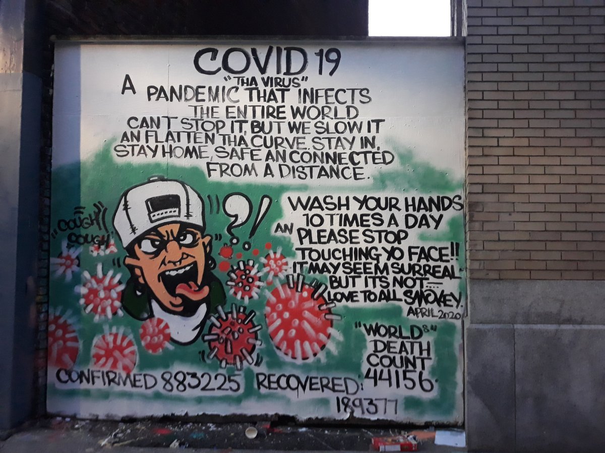A mural in Vancouver's Downtown Eastside warning about the dangers of #COVID-19.