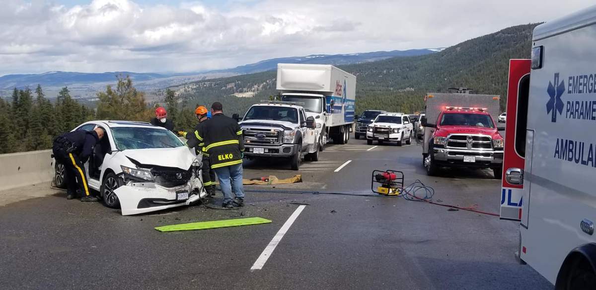 The driver of this white Honda Civic suffered serious injuries as a result of the head-on crash. A yellow line indicating two directions of traffic is not visible on the roadway.