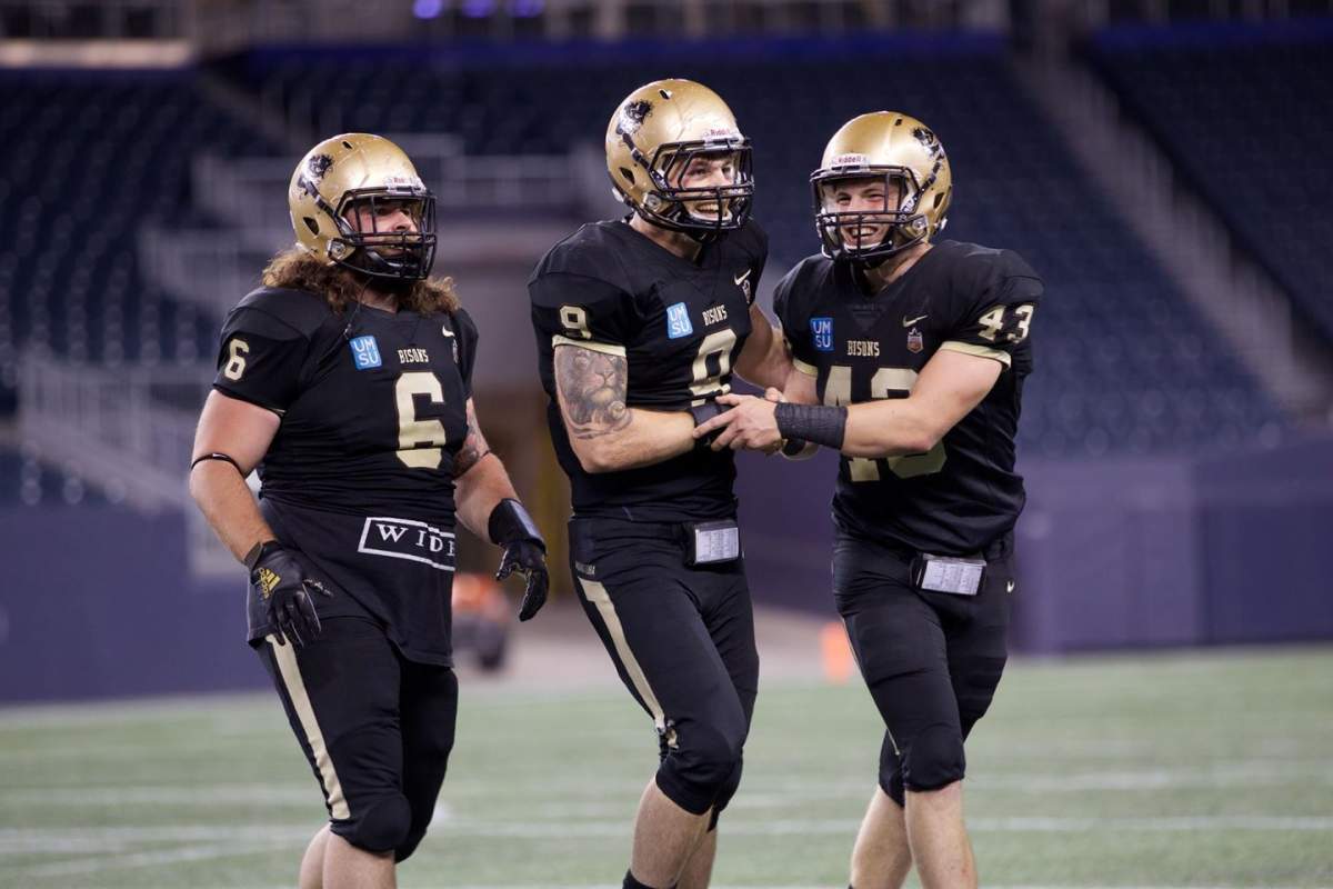 U of M Bison DL Brock Gowanlock {center) could be the first Defensive player out of Canada West to be selected in tonight's CFL draft. Photo supplied by Bison Sports. 