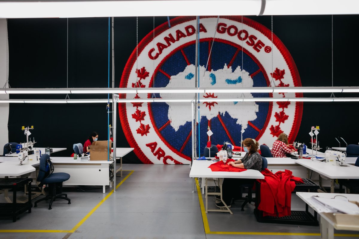 Photo of workers inside a Canada Goose manufacturing facility producing medical gowns for the fight against COVID-19.