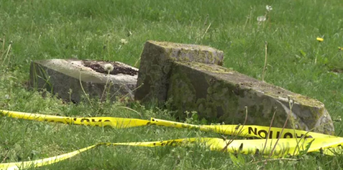 Several gravestones at a Surrey cemetery have been damaged.
