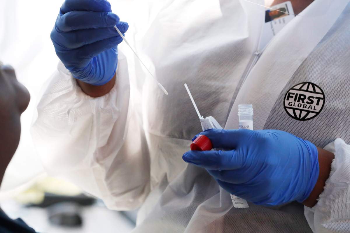 A nurse prepares to administer a COVID-19 test. Peterborough Public Health as 59 confirmed cases of coronavirus.