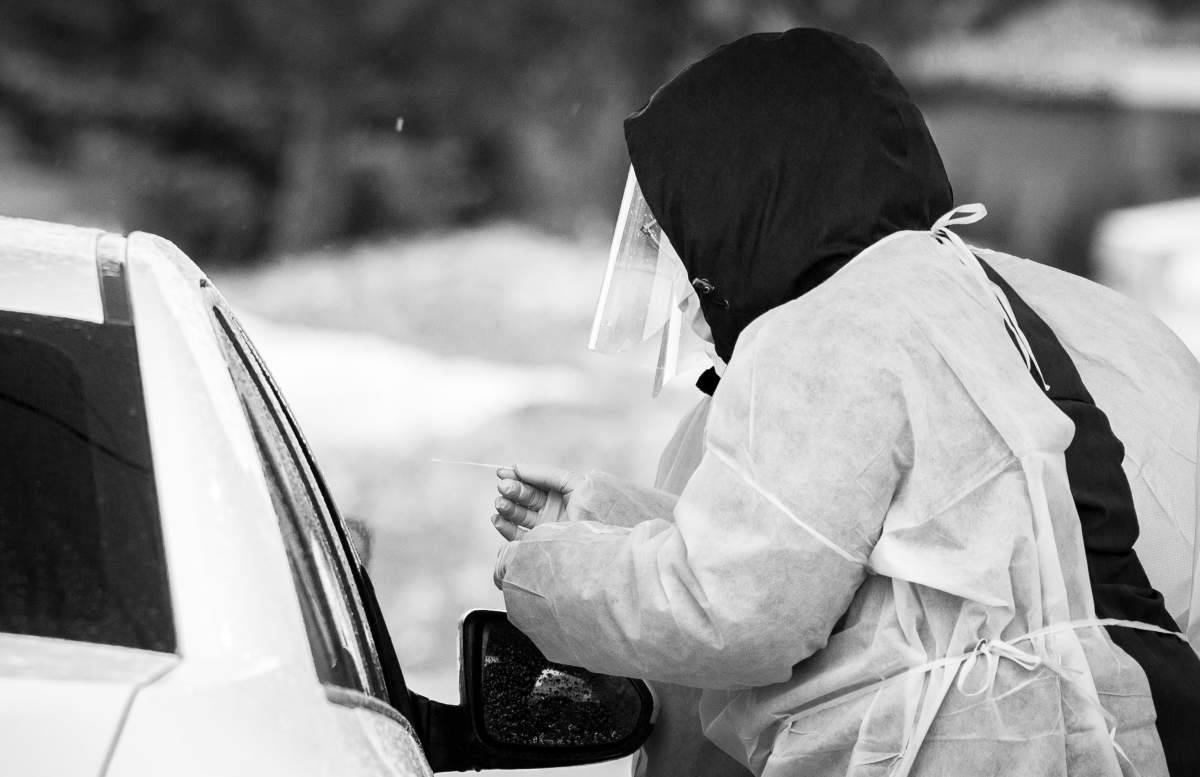 A technician prepares a nasal swab to test a patient for COVID-19 at a drive-through, appointment-only testing site at the Cavendish Mall in Côte Saint-Luc, , 2020. Sunday March 29, 2020. Phil Carpenter/Global News