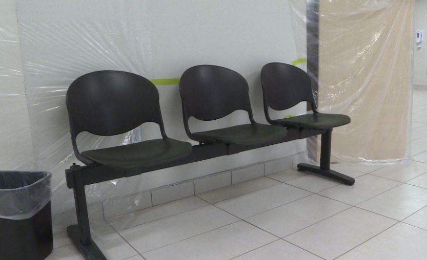 Patients enter through a seperate entrance than staff. Before entering the clinic they have their vital signs checked and are given a mask and hand sanitizer.