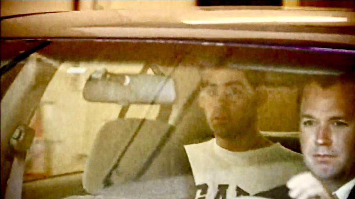 Daniel Sylvester in a police vehicle.