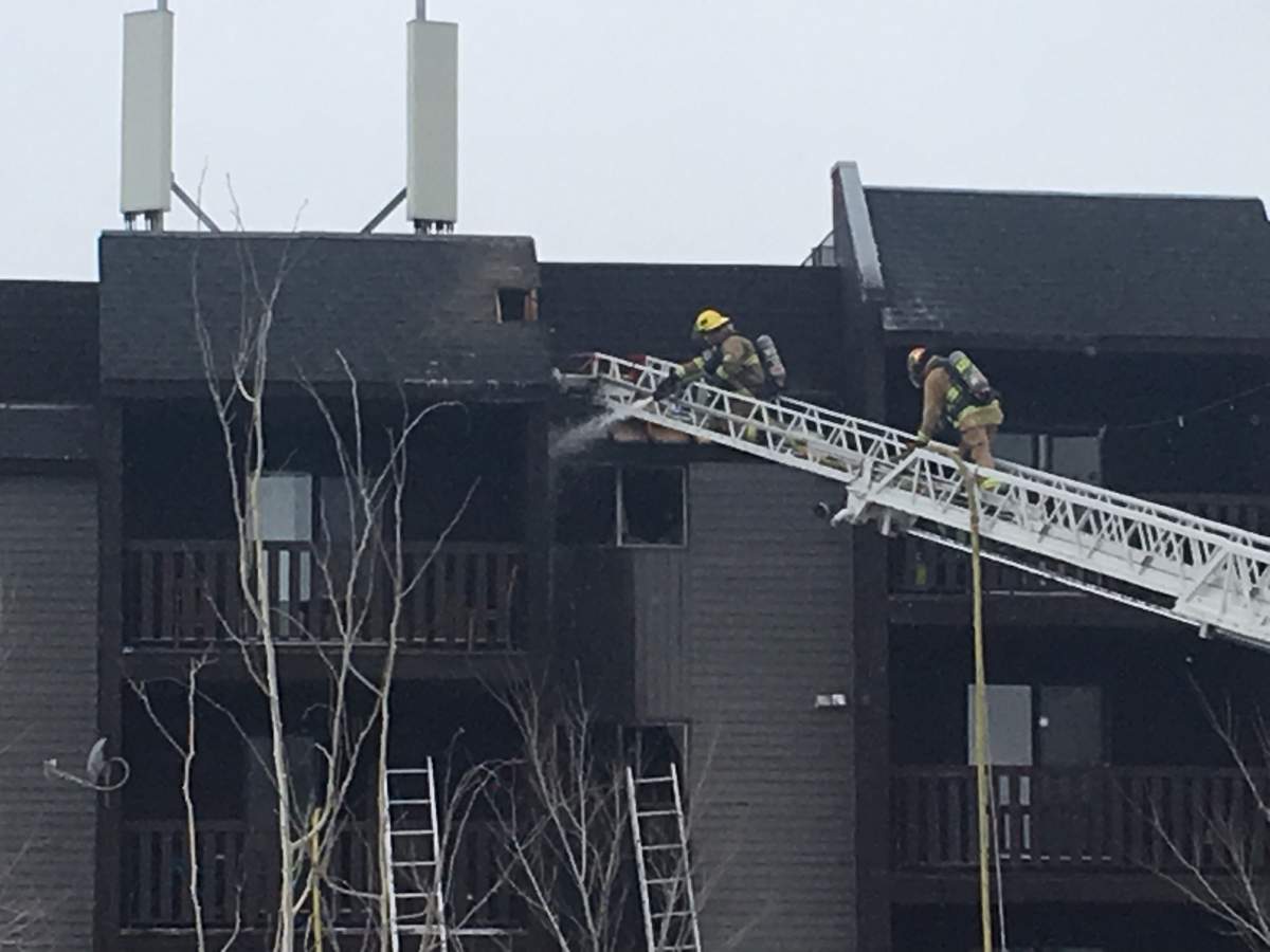 Calgary firefighters fight a blaze in the southeast community of Dover on Thursday.