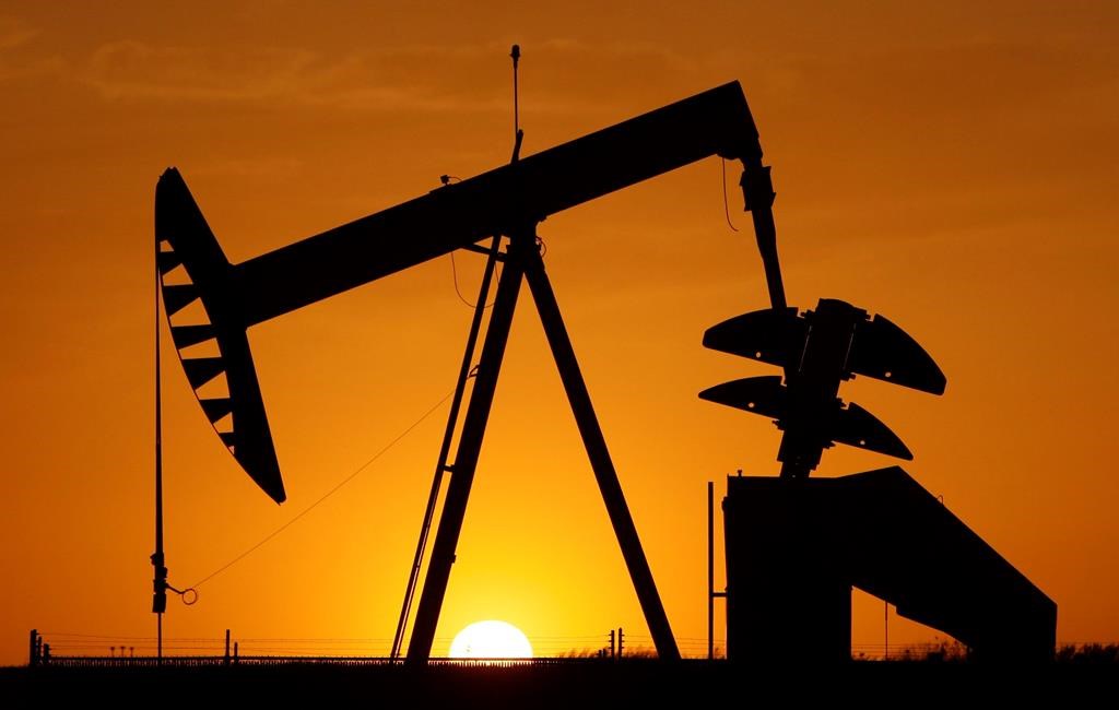In this March 22, 2012 file photo, a pumpjack is silhouetted against the setting sun in Oklahoma City.