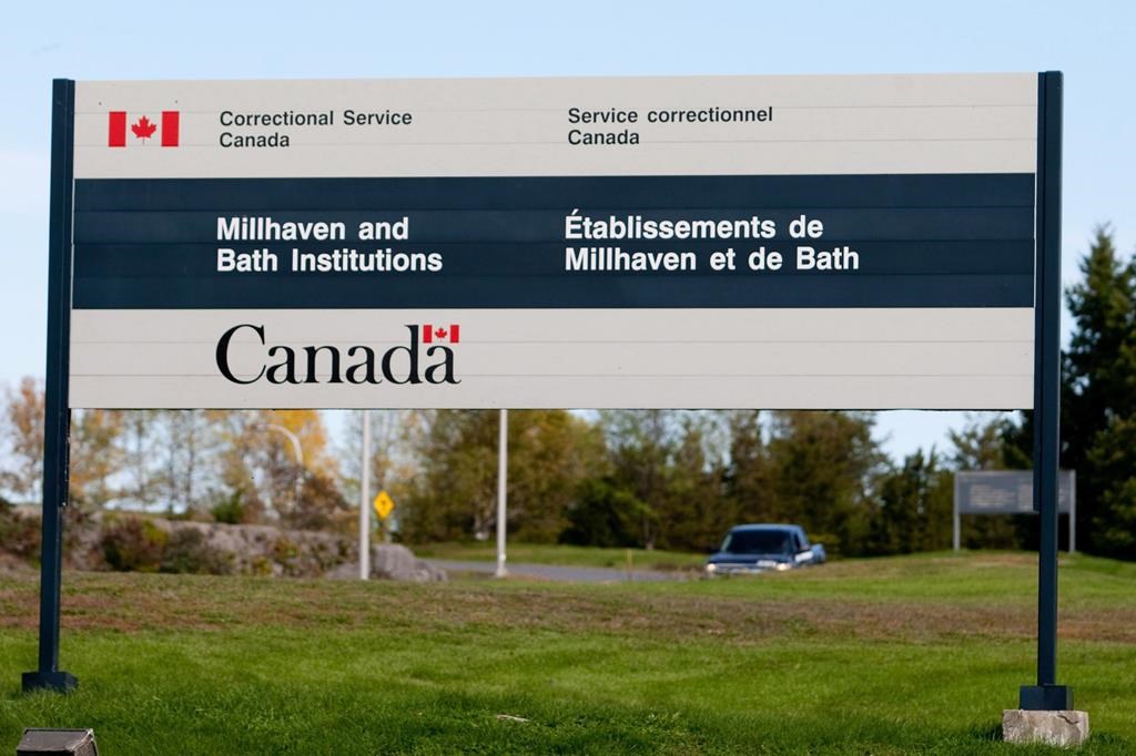 A sign for Millhaven and Bath institutions stands outside the maximum-security prison in Bath, Ont., in this file photo.