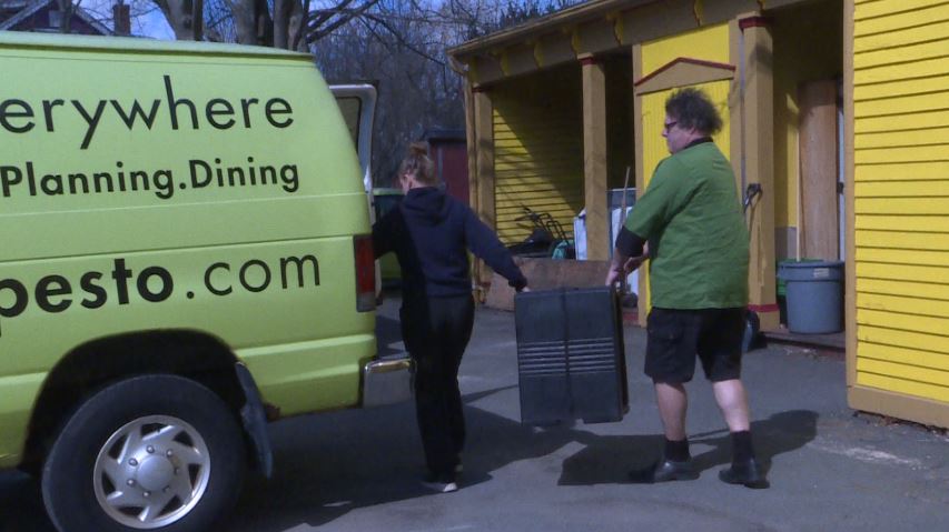 Easter dinner meals are loaded into a catering van.