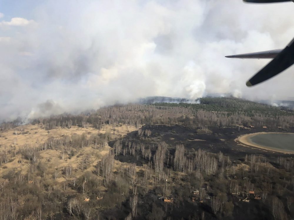 In this photo made on Saturday, April 4, 2020, an aerial view of a forest fire burning near the village of Volodymyrivka in the exclusion zone around the Chernobyl nuclear power plant, Ukraine.