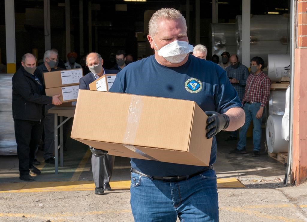 Approval ratings for Canadian politicians, such as Ontario Premier Doug Ford, pictured here helping unload a shipment of medical masks, have soared in the coronavirus crisis. But pollster Darrell Bricker isn't sure those high ratings will last.