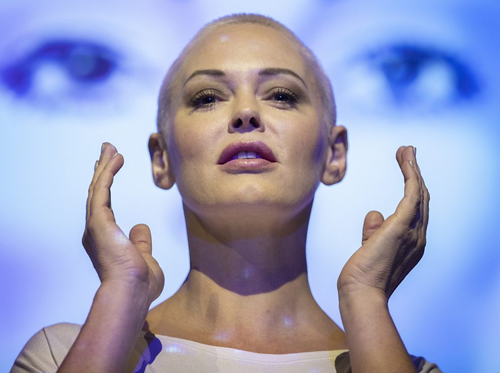 Actress and activist Rose McGowan on stage at the Assembly Hall, Edinburgh, with backdrop projections from her debut stage show 'Planet 9,' which premieres at the Edinburgh Festival.