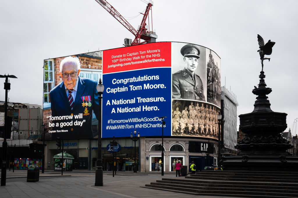 An hourly salute to Capt. Tom Moore in Piccadilly Circus, London. The 99-year-old war veteran’s challenge to raise money for National Health Service charities by walking 100 laps of his garden before his 100th birthday hit £20 million less than two weeks after he began the challenge. He recently completed his 100 laps.