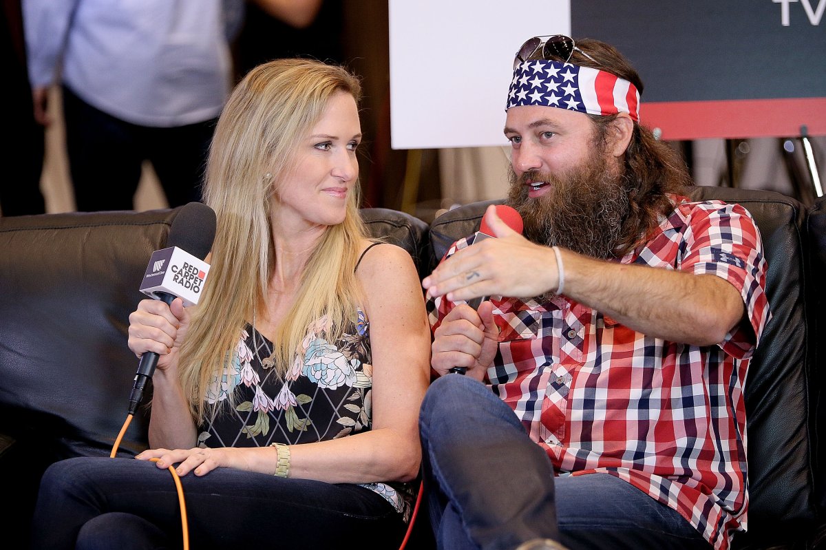 TV personalities Willie Robertson (R) and Korie Robertson speak at the Red Carpet Radio presented by Westwood One Radio during the 50th Academy of Country Music Awards at Arlington Convention Center Grand Hall on April 18, 2015 in Arlington, Texas.  