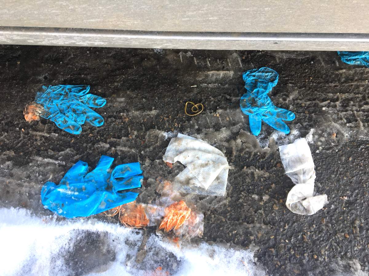 Gloves lay in a south Edmonton grocery store parking lot Monday, April 6, 2020.