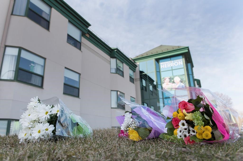 Flowers are shown outside Maison Herron, a long term care home in the Montreal suburb of Dorval, Sunday, April 12, 2020, as COVID-19 cases rise in Canada and around the world. THE CANADIAN PRESS/Graham Hughes.