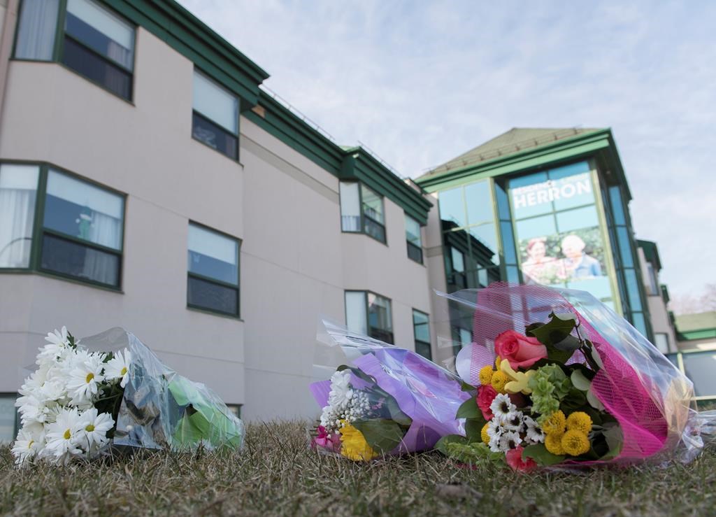 Flowers are shown outside Maison Herron, a long-term care home in the Montreal suburb of Dorval, Sunday, April 12, 2020.