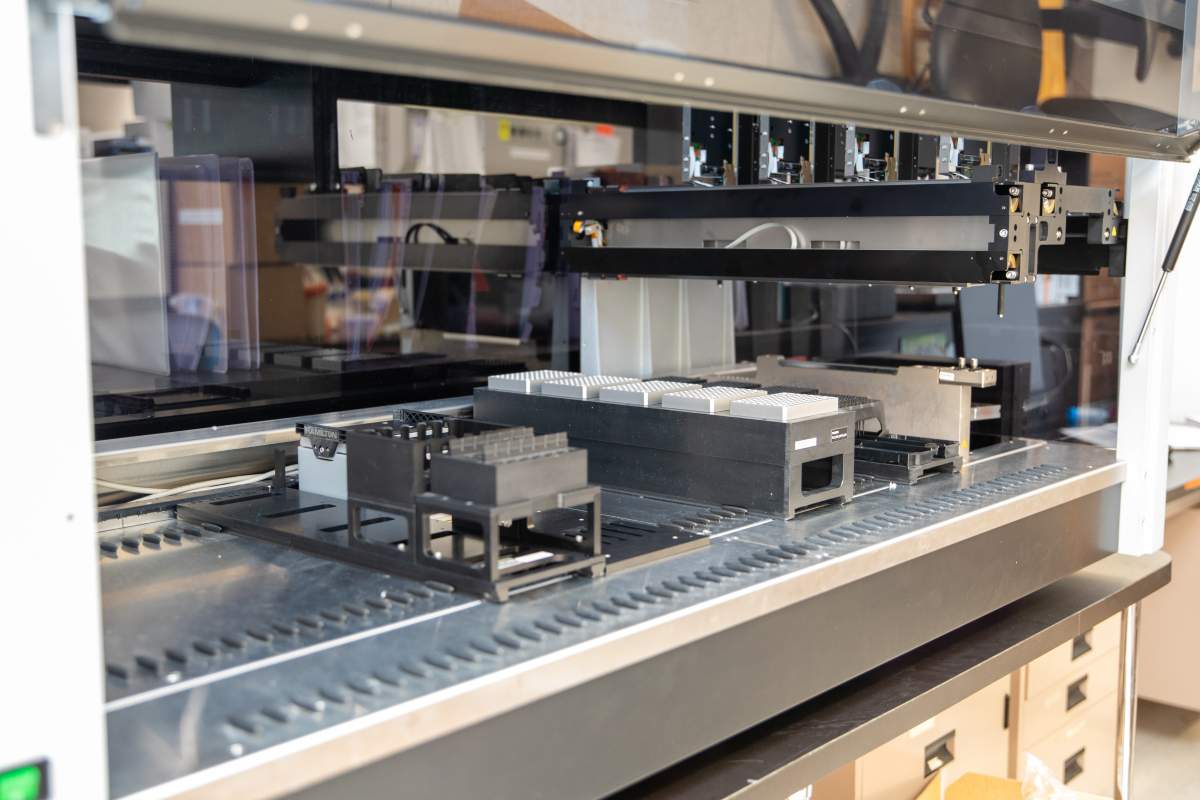 Researchers at St. Joe’s say robotics are helping with coronavirus test samples through a two-stage setup where vials go into a biosafety cabinet so the liquids can be safely handled.