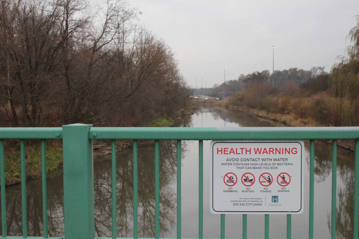 A City of Hamilton health warning sign on a walkway over Chedoke Creek. Public health says study on a 24 billion litre spill of storm water runoff and sanitary sewage was not linked to any illness in the city since 2014.
