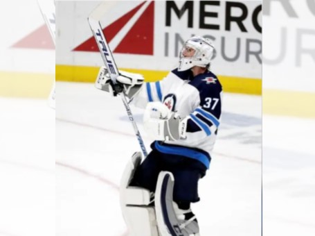 Winnipeg Jets goaltender Connor Hellebuyck celebrates after a win over the Anaheim Ducks in Anaheim, Calif., Nov. 29, 2019. 