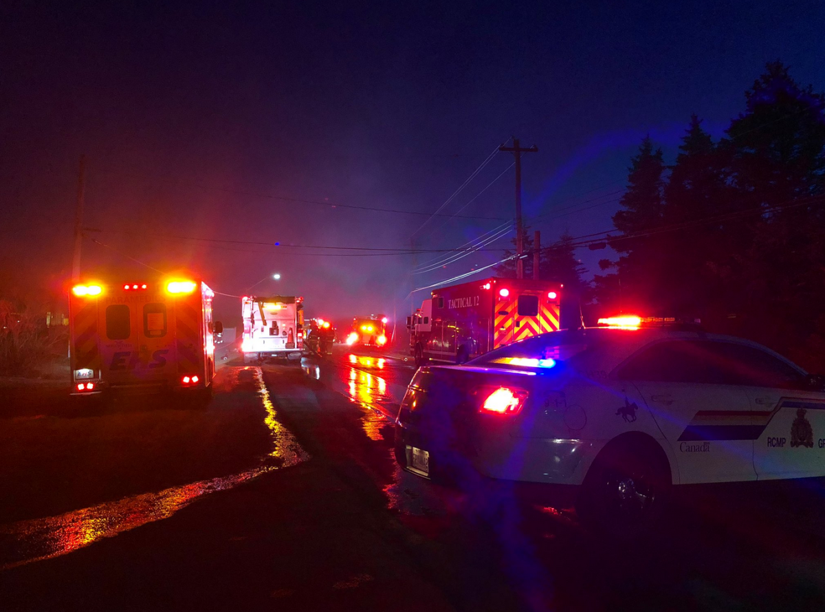 Emergency crews respond to a fire along Cow Bay Road on Tuesday, April 7, 2020. 
