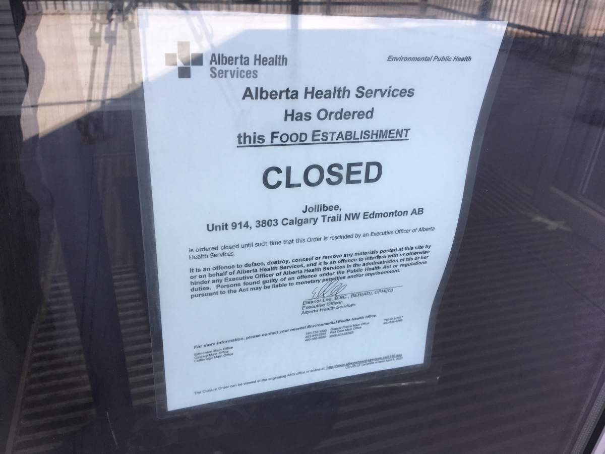 A notice from Alberta Health Services ordering the Jollibee restaurant on Calgary Trail in Edmonton closed.