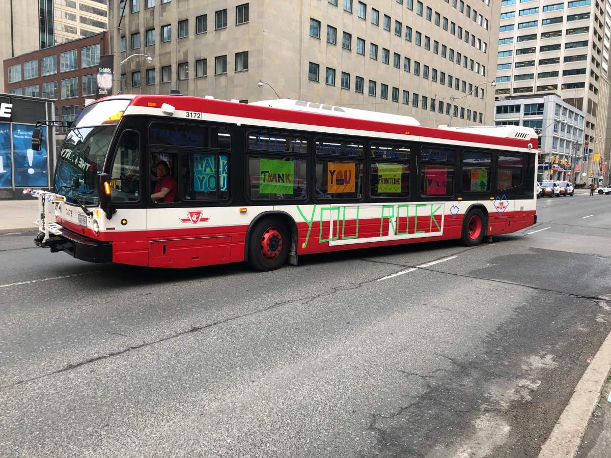 TTC employees drive down University Avenue on Thursday as part of an appreciation parade to thank frontline health-care workers responding to COVID-19.