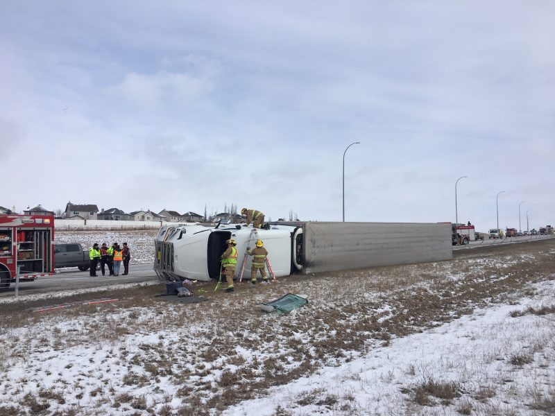 Calgary firefighters respond to a rollover on Stoney Trail Northwest on Wednesday, April 1, 2020.