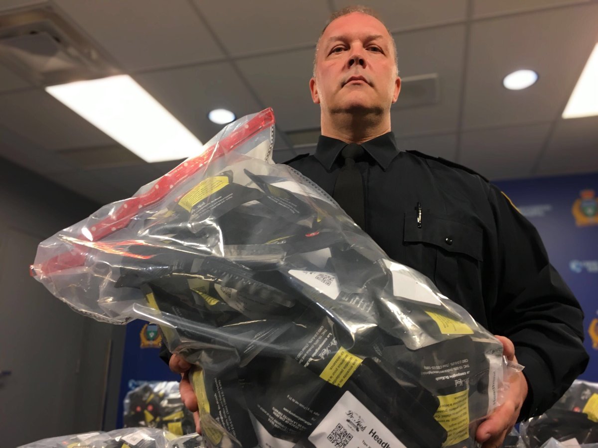 Winnipeg Police Service Ptrl-Sgt. Jeffrey Norman displays illegal cannabis seized Wednesday.