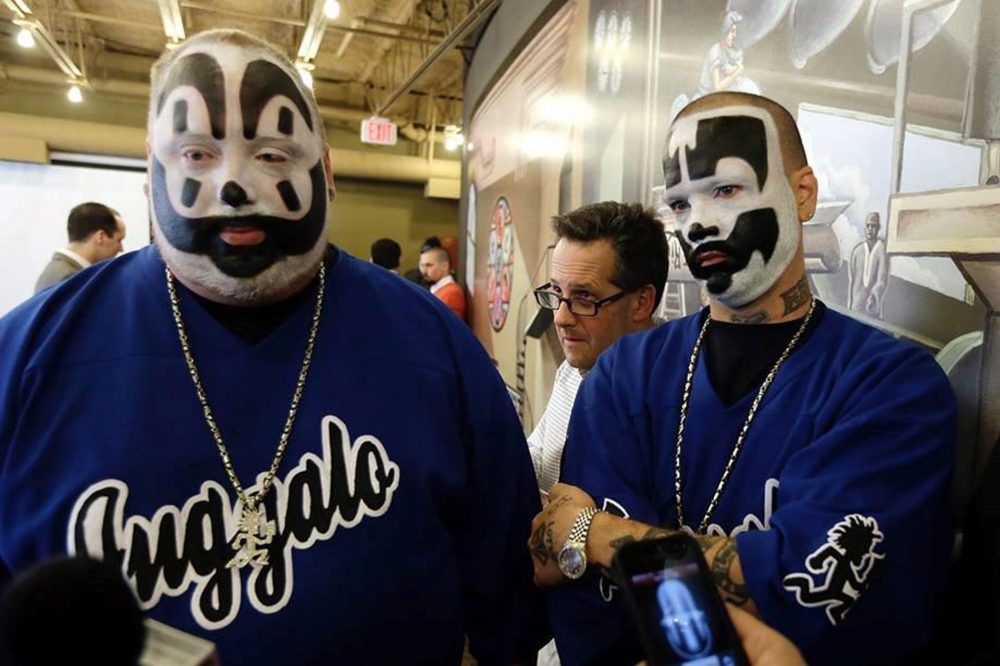 In this Jan. 8, 2014 photo members of rap-metal music group Insane Clown Posse appear at a news conference in Detroit. 