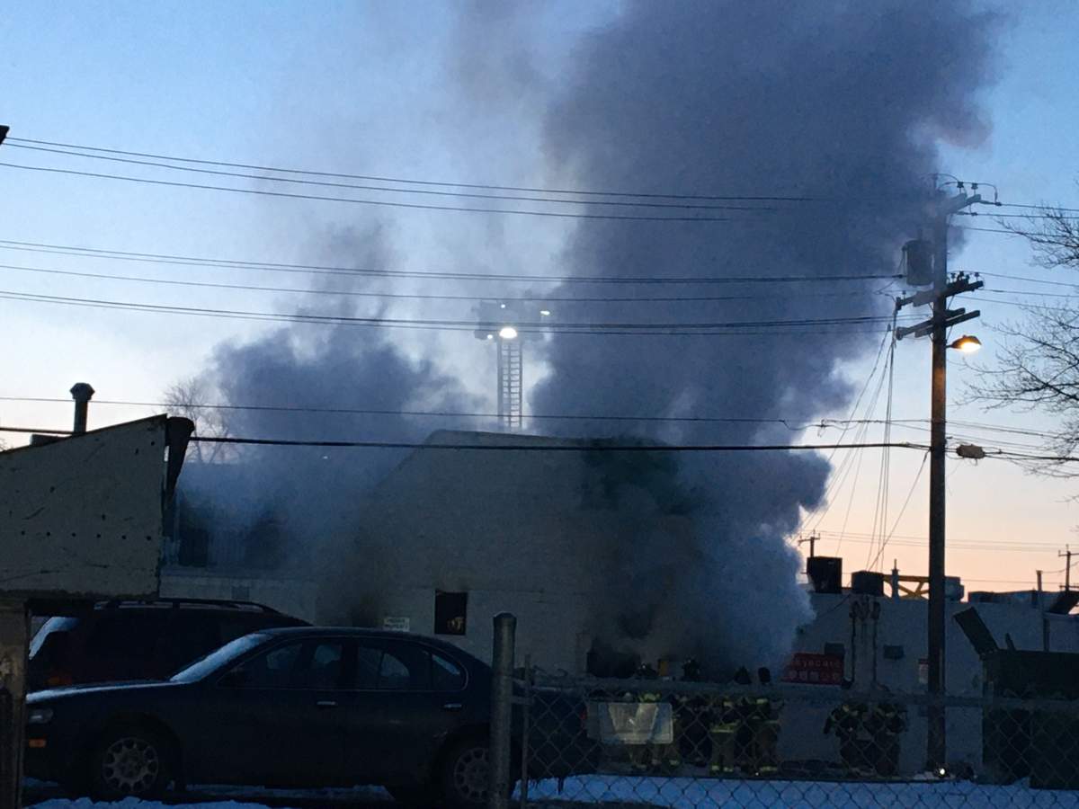 Fire crews work to douse a blaze at a building that houses the Italian Bakery, on 97 Street and 106 Avenue Friday, April 3, 2020.