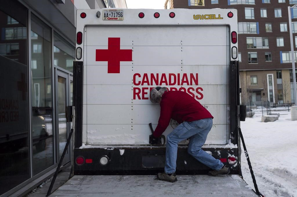 Bill Behse of the Canadian Red Cross checks the contents of an emergency shelter unit in Toronto on January 5, 2018. THE CANADIAN PRESS/Christopher Katsarov.
