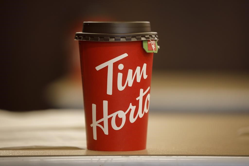 A Tim Hortons cup is seen inside a Tim Hortons restaurant in Toronto on March 6, 2020.