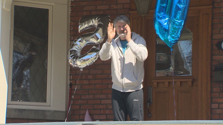 Jeff Pennefather waves to his neighbours who came out to sing happy birthday. Monday, April 20, 2020.